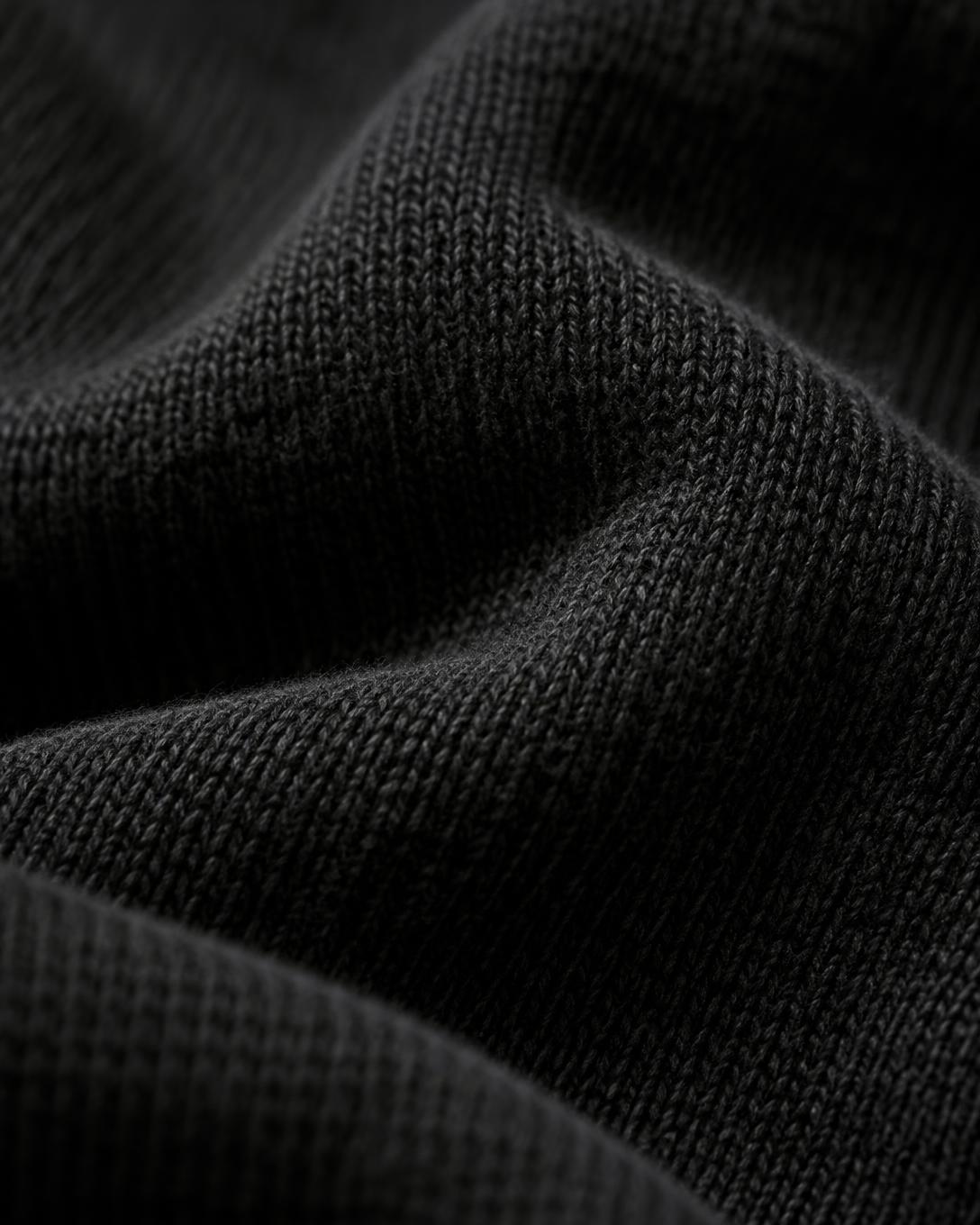 Macro detail of heavyweight black cotton fabric